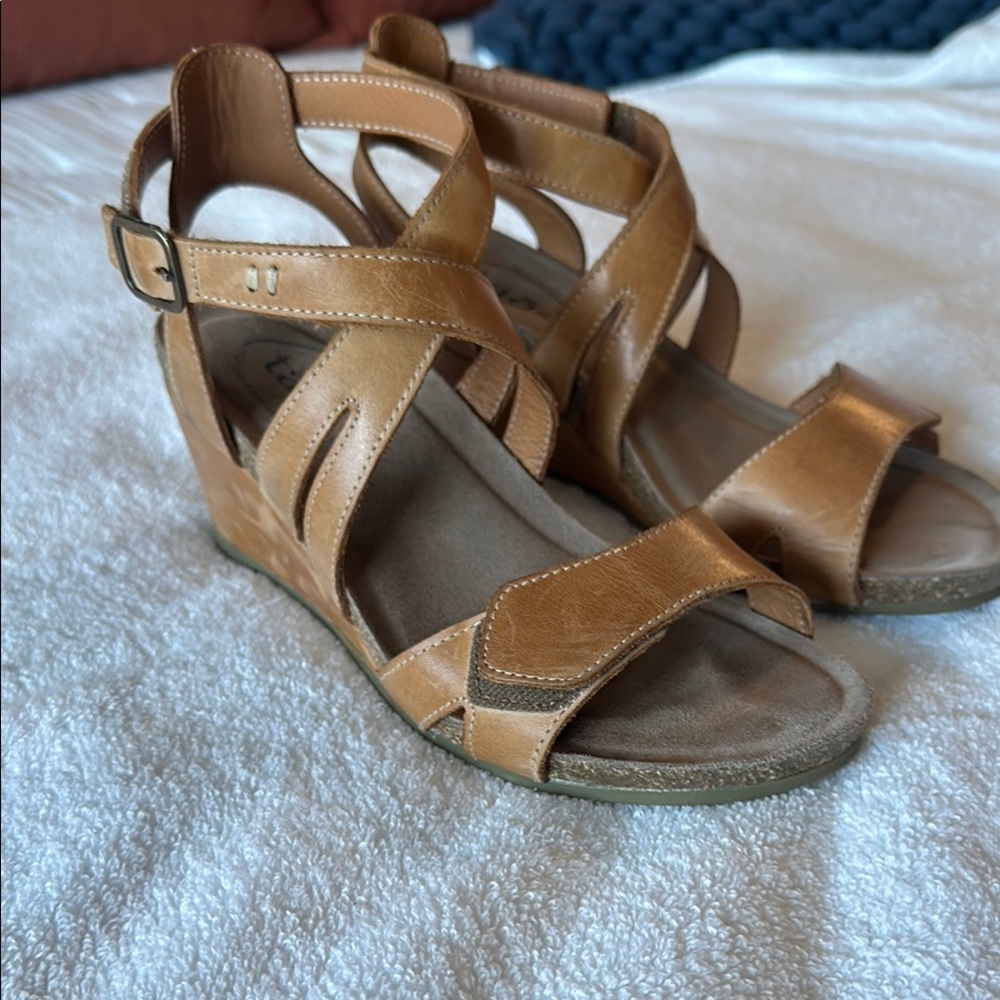 Used Taos Tan Leather Wedge Sandals with Crisscross Straps.  Size 37